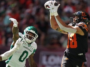 B.C. Lions' Justin McInnis makes a touchdown reception as Saskatchewan Roughriders' Rolan Milligan Jr. defends during CFL game in Vancouver July 13, 2024.