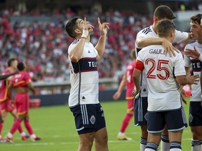 Vancouver Whitecaps' Brian White gestures skyward after scoring during the first half of an MLS soccer match against St. Louis City, Saturday, July 13, 2024, in St. Louis.