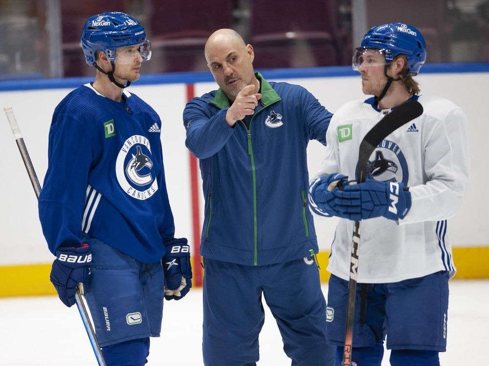 Vancouver Canucks Elias Pettersson and Brock Boeser with coach Rick Tocchet at team practice Saturday, March 2, 2024.
