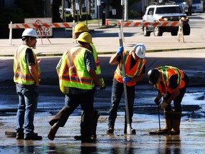 Workers fix sewer line break