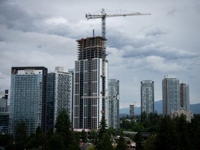Greater Vancouver's real estate board says the number of homes sold in June tumbled 19.1 per cent from the previous year as inventory continued accumulating to levels not seen since the spring of 2019. Buildings under construction are pictured in Surrey, B.C. on Wednesday, June 26, 2024.