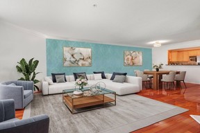 Home has been updated with high-gloss piano wood floors, crown moulding and new appliances.