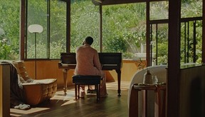 John Legend plays the piano