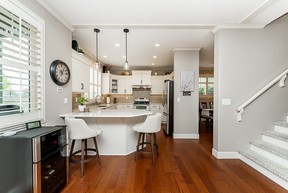 Modern kitchen with island and hardwood flooring