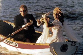 Lifeguards Jeff McNeill and Karen Wheatcroft stole away in a lifeguard boat for some wedding pictures. Their son is now also a lifeguard.
