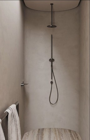 Microcement is a budget-friendly material that works well in a bathroom reno.