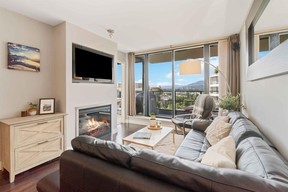 This North Vancouver condo offers far-reaching water, city and mountain vistas.