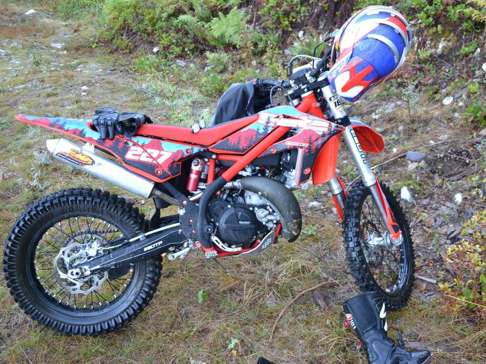 A year after man found dead while dirt biking on Sunshine Coast, his son is charged with his murder