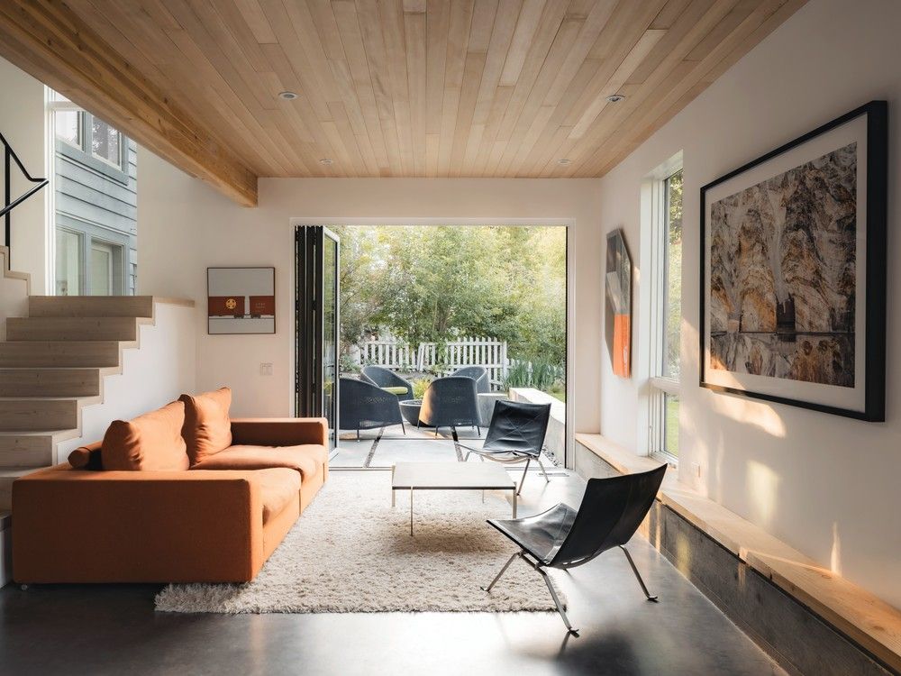 Clean lines and a modern minimalist palette create a canvas for the family's extensive art collection.