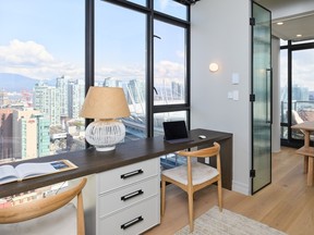 With access relocated off the home's dining room via full-height reeded glass doors, a second bedroom became a flex-office space with a Murphy bed to sleep guests.