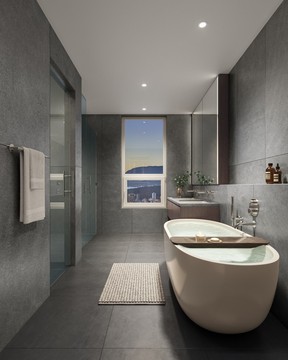 Large format porcelain tiles anchor the hospitality-inspired bathrooms, which also feature frameless showers and a stand-alone tub.