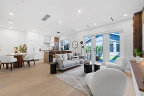 Interior features modern finishings like white oak floors, custom millwork, a surround sound system, air conditioning and high-end Fisher & Paykel appliances.