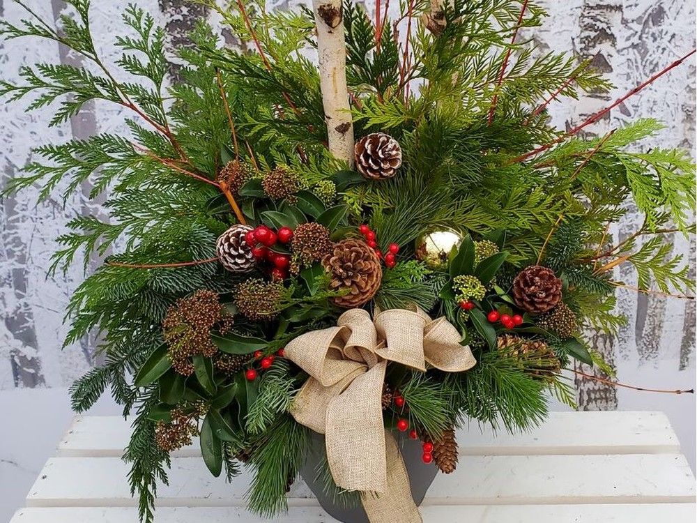 Even though pots are no longer filled with sunny summer annuals, they are ideal — including the wet soil — for dressing up with an array of various attractive greens. Minter Country Garden photo