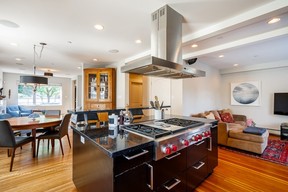 Inviting and modernized open-concept living area with stylish kitchen.