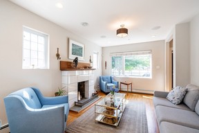 living room with fireplace in character home