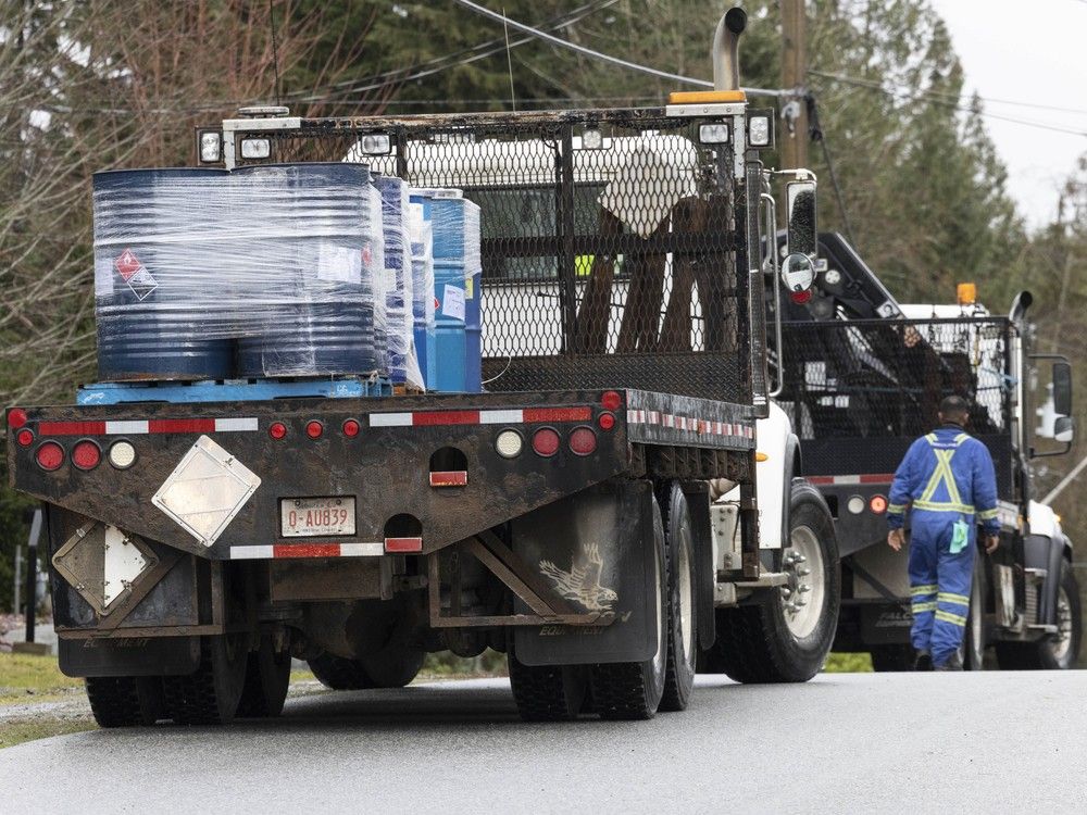 Drums of chemicals loaded onto a truck at a house on 124th Avenue in Maple Ridge on Dec. 7, 2024. The home is owned by Bobby Shah.