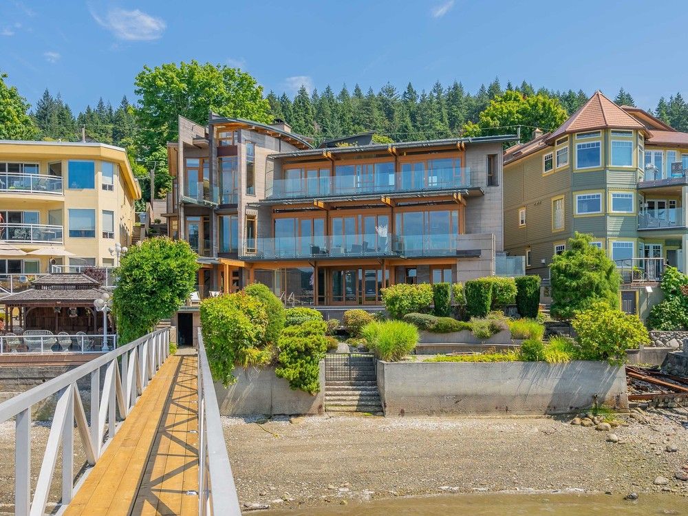 Sold (Bought): Custom-built Port Moody residence offers infinity pool and moorage for a yacht