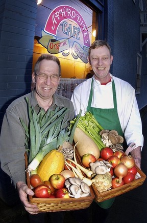 Archive image of Aprhodite's Cafe founder Allan Christian (left) and chef David Alsop with basket of organic vegetables outside the 4th Ave. restaurant.