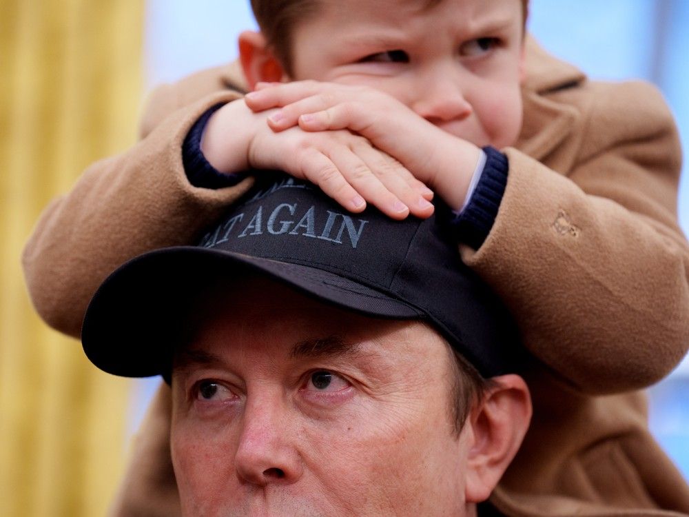 X Musk sits on the shoulders of his father, Tesla and SpaceX CEO Elon Musk, as they join U.S. President Donald Trump for an executive order signing in the Oval Office at the White House on February 11, 2025 in Washington, DC. X Musk sits on the shoulders of his father, Tesla and SpaceX CEO Elon Musk, as they join U.S. President Donald Trump for an executive order signing in the Oval Office at the White House on February 11, 2025 in Washington, DC.