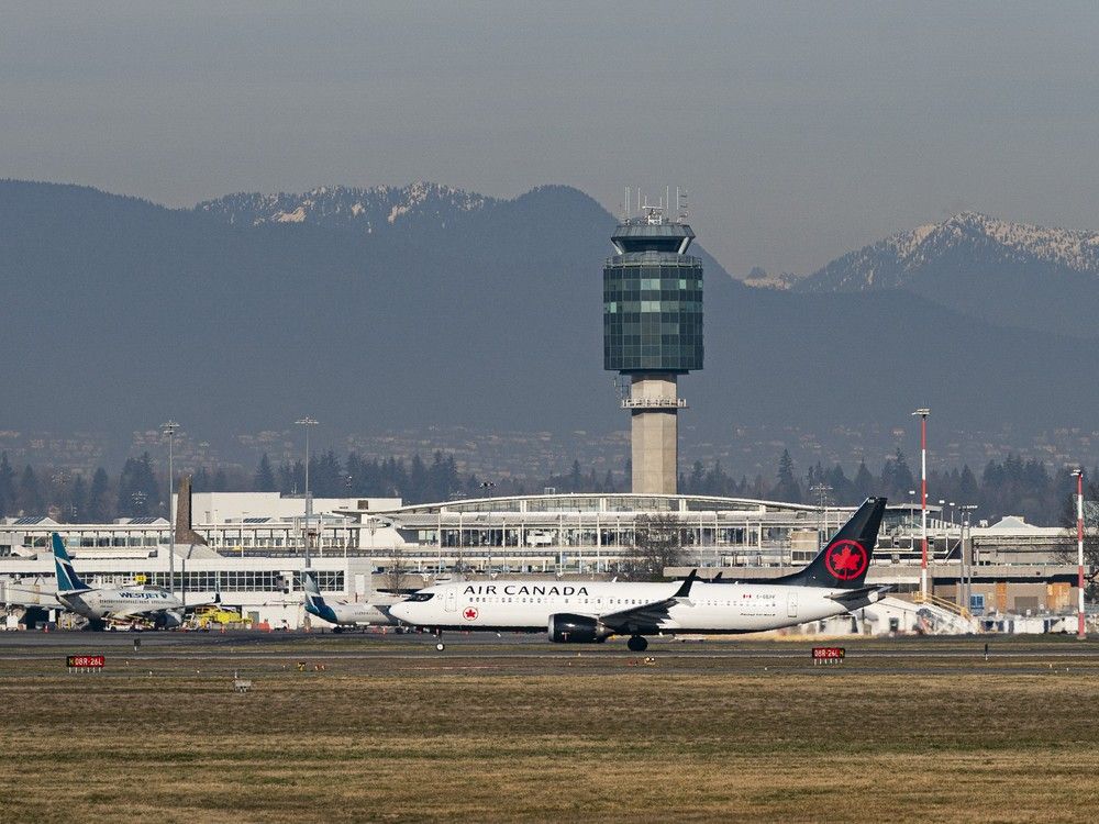 An Air Canada plane takes off at Vancouver International Airport. An Air Canada plane takes off at Vancouver International Airport.