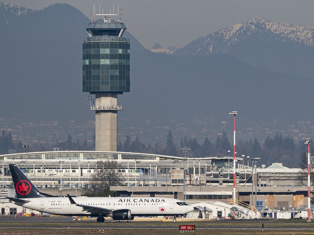  File photo: An Air Canada jet taxis to the runway at Vancouver International Airport.