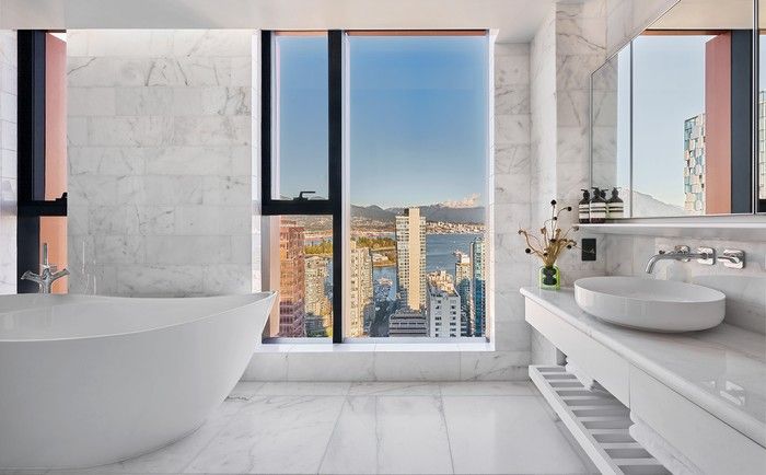  The stone in this bathroom is ‘Glacier White’, one of two colour schemes on offer. Each of the three bedrooms in the sub-penthouse has an ensuite.