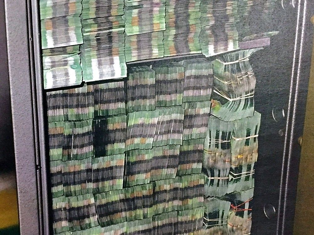 Bundles of 20 dollar bills seized in October 2015 as part of the RCMP E-Pirate investigation into money laundering at the alleged underground Richmond bank Silver International. Bundles of 20 dollar bills seized in October 2015 as part of the RCMP E-Pirate investigation into money laundering at the alleged underground Richmond bank Silver International.