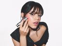 Dior Beauty Ambassador Jenna Ortega with the newRosy Glow Blush Stick.