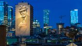 The mural honouring Leonard Cohen on Crescent is illuminated in Montreal. Dave Sidaway photo/Postmedia