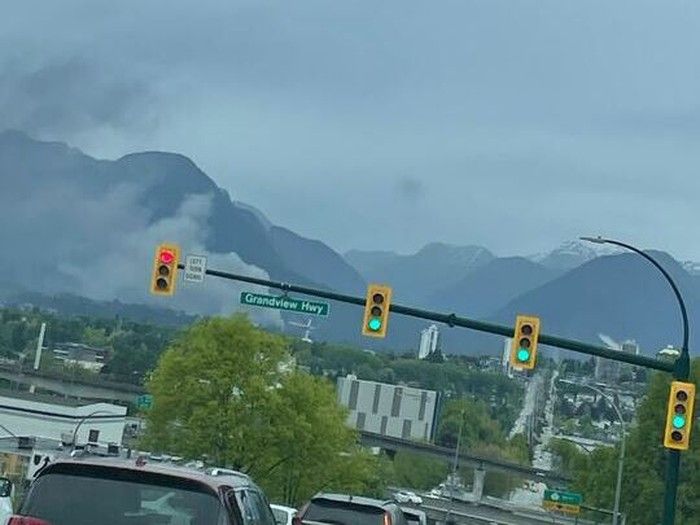 Firefighters are on scene at a 2nd alarm structure fire in Lynn Valley. Smoke is seen from east Vancouver. Handout photo. Firefighters are on scene at a 2nd alarm structure fire in Lynn Valley. Smoke is seen from east Vancouver. Handout photo.