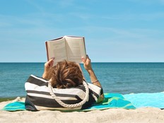 woman on the beach reading