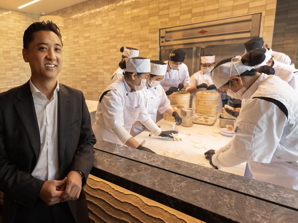 Dumpling trainees — training in Vancouver for months — drape the dough over a special light box to learn how to get the exact thickness.