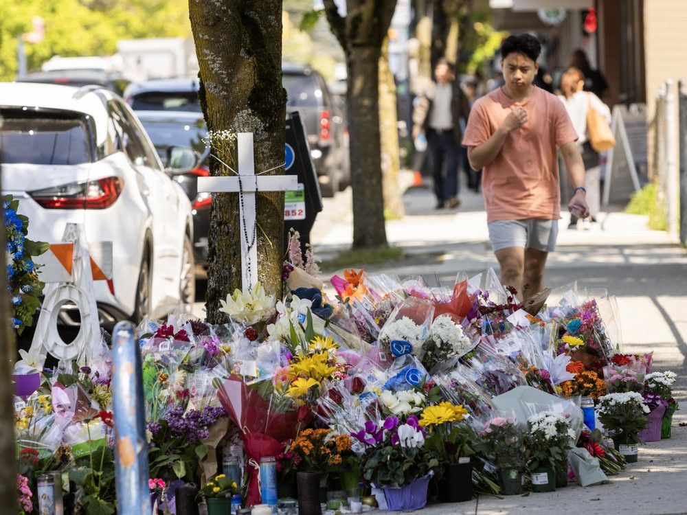 People leave flowers, teddy bears and candles in memory of victims of the Lapu Lapu Day tragedy on Fraser street in Vancouver May 1, 2025. People leave flowers, teddy bears and candles in memory of victims of the Lapu Lapu Day tragedy on Fraser street in Vancouver May 1, 2025.