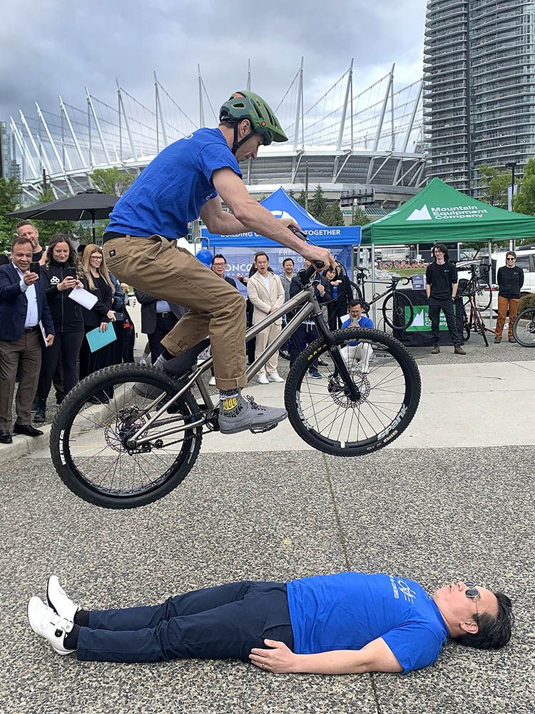 Vancouver Mayor Ken Sim puts his faith in a trick rider at the promotional event. Vancouver Mayor Ken Sim puts his faith in a trick rider at the promotional event.