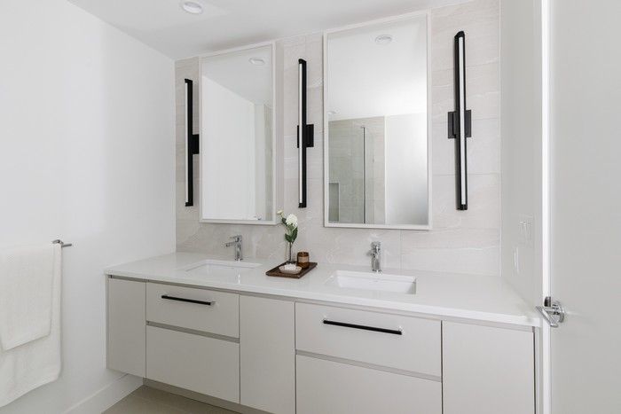  Large format tiles on the shower walls reflects an artistic interpretation of limestone with subtle veining — turning the bathroom into a luxurious retreat.