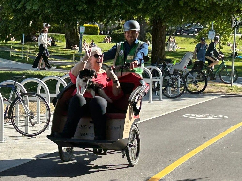 undated photo of vancouver cycling without age society volunteer (unnamed) with kitsilano’s helen mazurek, 84, and her dog wee angus in a trishaw. photo by vancouver cycling without age society /handout