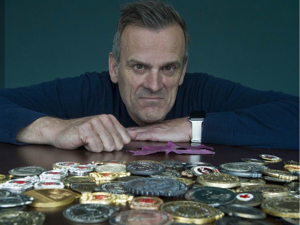  chris dallin with his track and field medal collection in 2019.