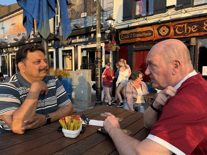 Sanjay Lazar, left, who lost his father, sister and stepmother in the Air India bombing, catches up with first responder Mark Stagg, who helped recover bodies, in Bantry, Ireland, on June 20, 2025. Sanjay Lazar, left, who lost his father, sister and stepmother in the Air India bombing, catches up with first responder Mark Stagg, who helped recover bodies, in Bantry, Ireland, on June 20, 2025.