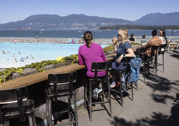 People relax on the patio at the Kits Pool concession. Jason Payne/ PNG People relax on the patio at the Kits Pool concession. Jason Payne/ PNG