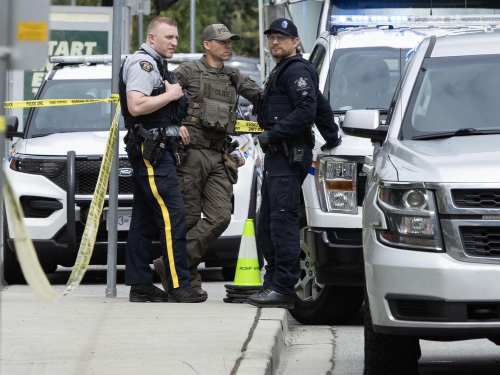 RCMP outside the constituency office of Bowinn Ma, minister of infrastructure and MLA for North Vancouver-Lonsdale, on Friday.