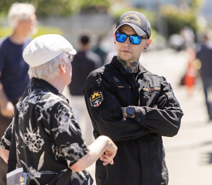 Master Sailor Tristan Harris, originally from Harrison Hot Springs, chats with civilians during Vancouver Fleet Week at Burrard Dry Dock Pier in North Vancouver on June 30, 2025. Master Sailor Tristan Harris, originally from Harrison Hot Springs, chats with civilians during Vancouver Fleet Week at Burrard Dry Dock Pier in North Vancouver on June 30, 2025.