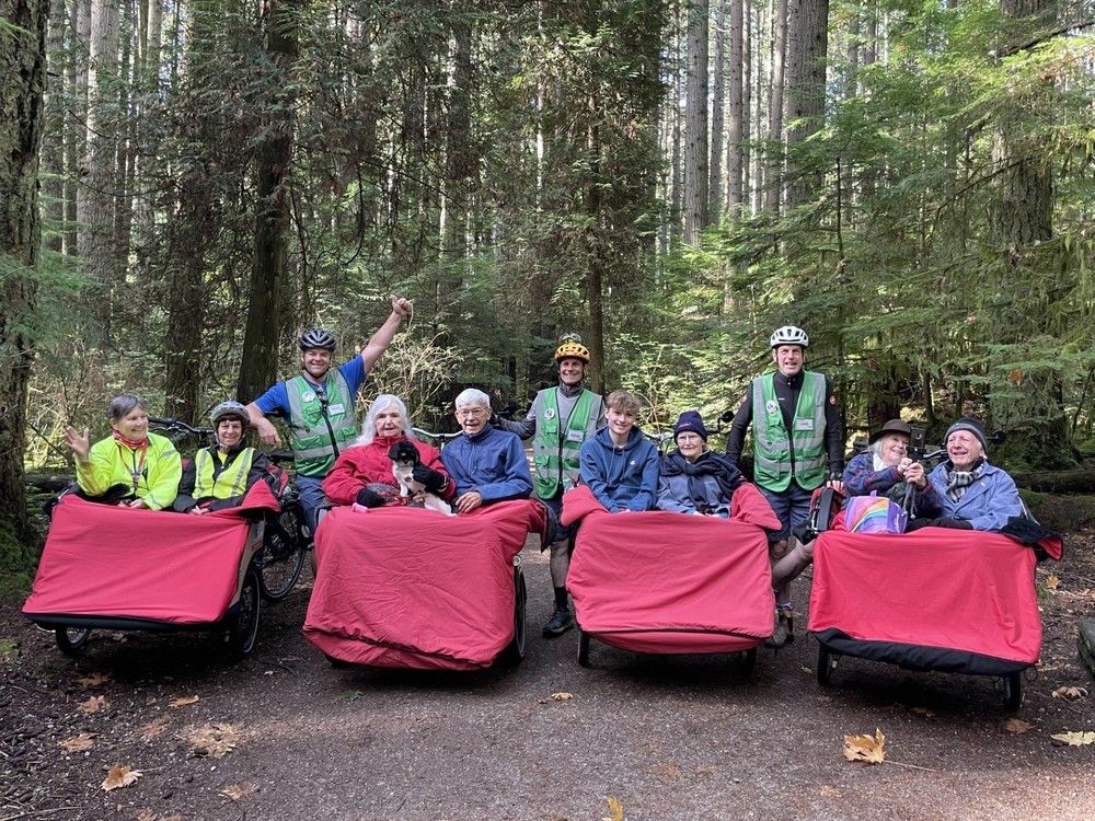  undated photo of vancouver cycling without age society volunteers (unnamed) with seniors. photo by vancouver cycling without age society /handout