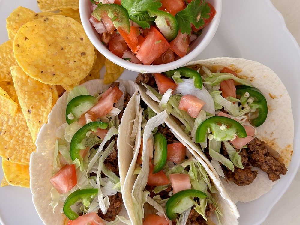 Juicy tomatoes, zippy lime, a little cilantro and just enough heat to keep these soft tacos interesting.