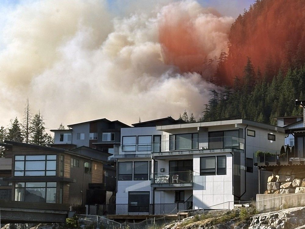 Smoke from an out of control wildfire could be seen behind properties on Dowad Drive in Squamish on June 9, 2025. The wildfire broke out east of Highway 99 between Dowad Drive and Depot Road June 10, 2025. Smoke from an out of control wildfire could be seen behind properties on Dowad Drive in Squamish on June 9, 2025. The wildfire broke out east of Highway 99 between Dowad Drive and Depot Road June 10, 2025.