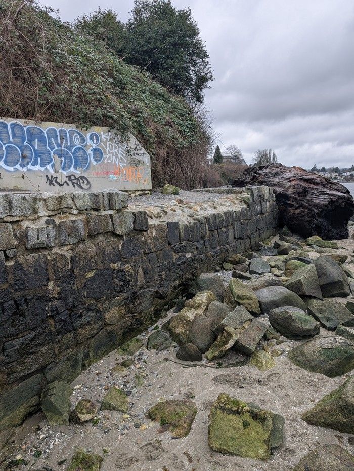 Handout photo of the damage done by a log to the seawall at Trafalgar Beach in Vancouver Handout photo of the damage done by a log to the seawall at Trafalgar Beach in Vancouver
