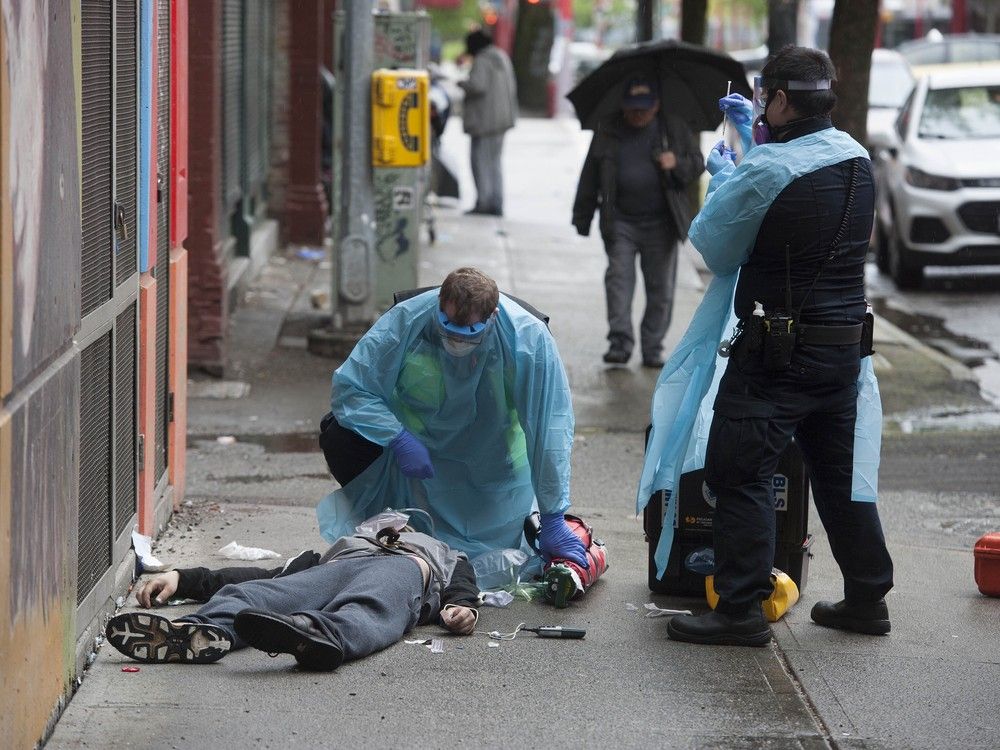 Paramedics help a man suffering a drug overdose on Columbia Street in Vancouver’s Downtown Eastside on May 2, 2020. Paramedics help a man suffering a drug overdose on Columbia Street in Vancouver’s Downtown Eastside on May 2, 2020.
