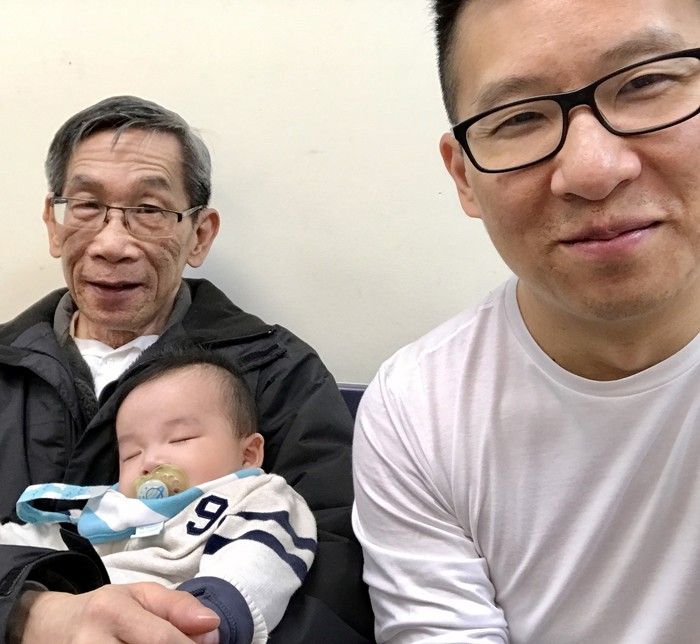  vancouver, b.c.: jeff ho (l) holds his grandson sitting beside his son, chris ho (r).