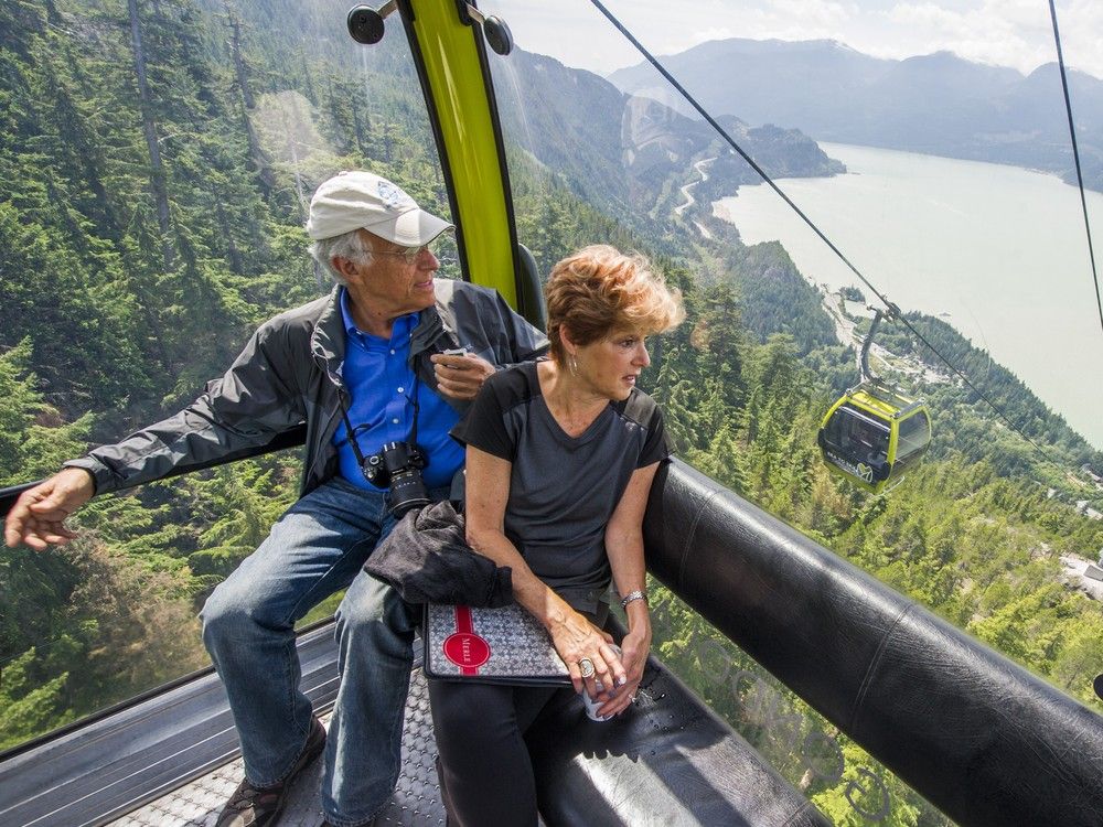  riding the gondola at the sea to sky gondola in squamish.
