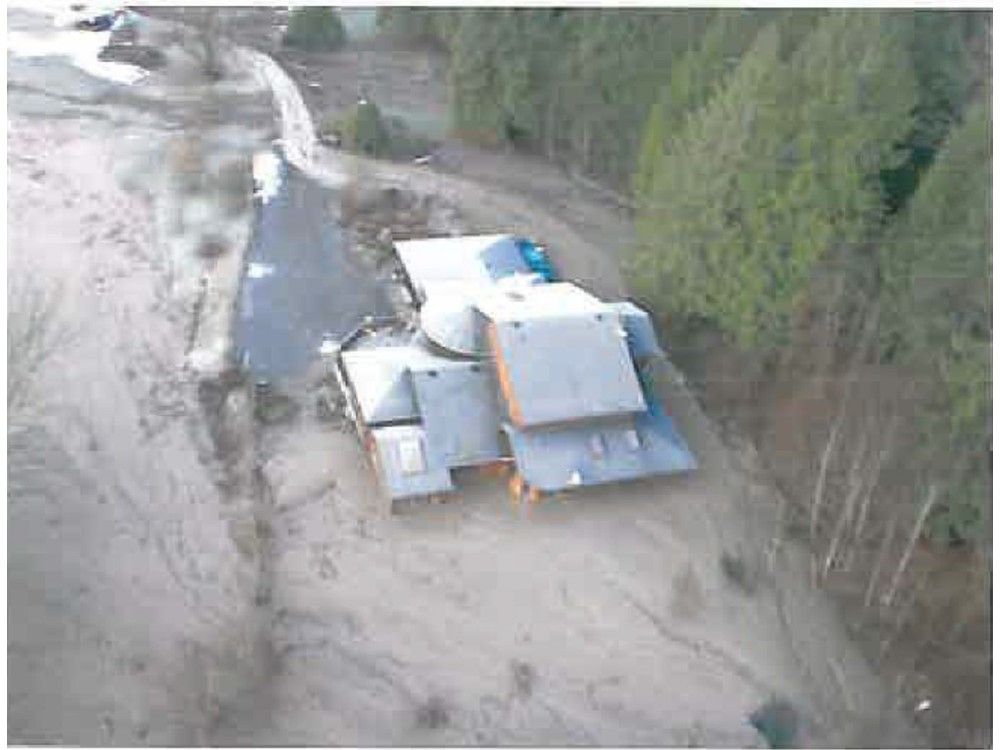 Screenshot of a photo in Golder Associates report: Emergency geotechnical hazard assessment of recent debris flow activity 46931 Chilliwack Lake Road (Site 1) Chilliwack B.C. dated Jan. 26, 2009.