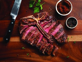 Hy's porterhouse sliced on board: